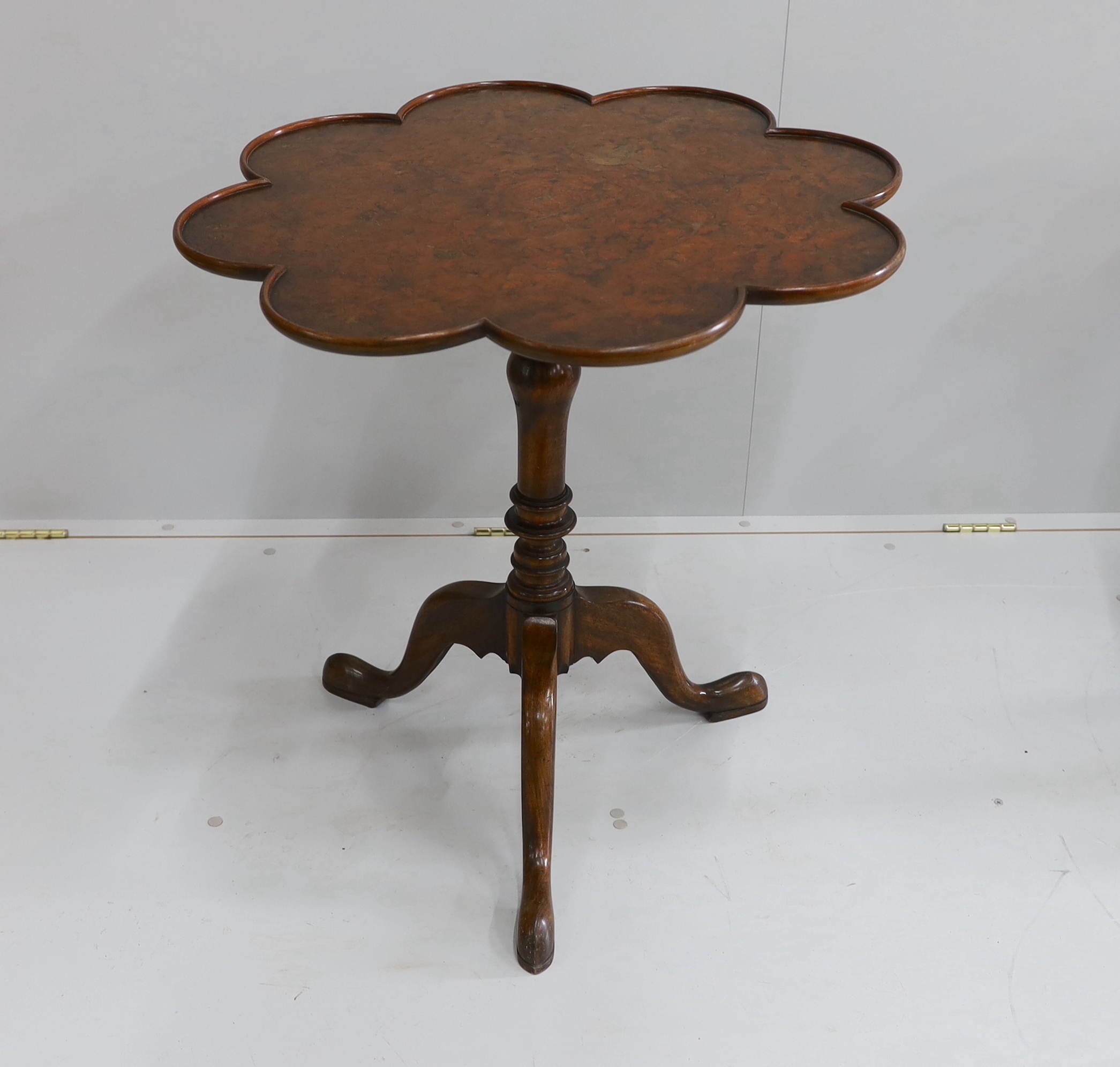 A pair of reproduction George III style mahogany and bird's eye maple tilt top tripod tea tables, width 68cm, height 69cm